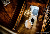 couple exiting old house